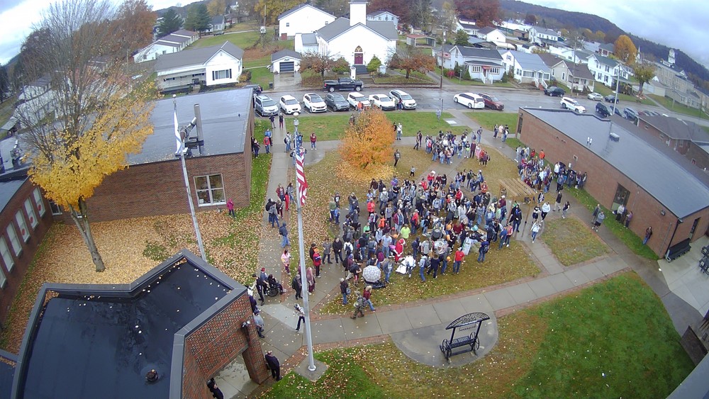 Aerial view of the front of Wirt County High School with the student body standing out front.
